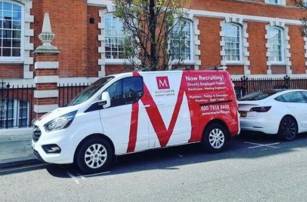 Masterfix branded van parked outside old decorative building