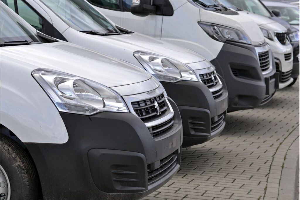 grey vans lined up in a row