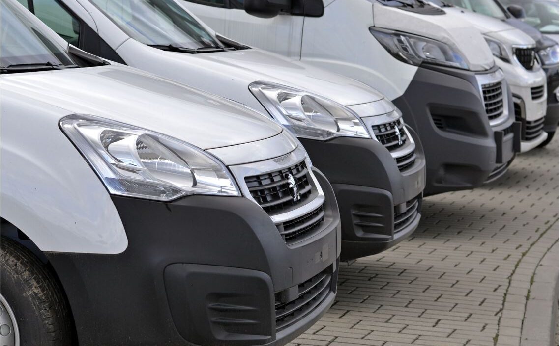 grey vans lined up in a row