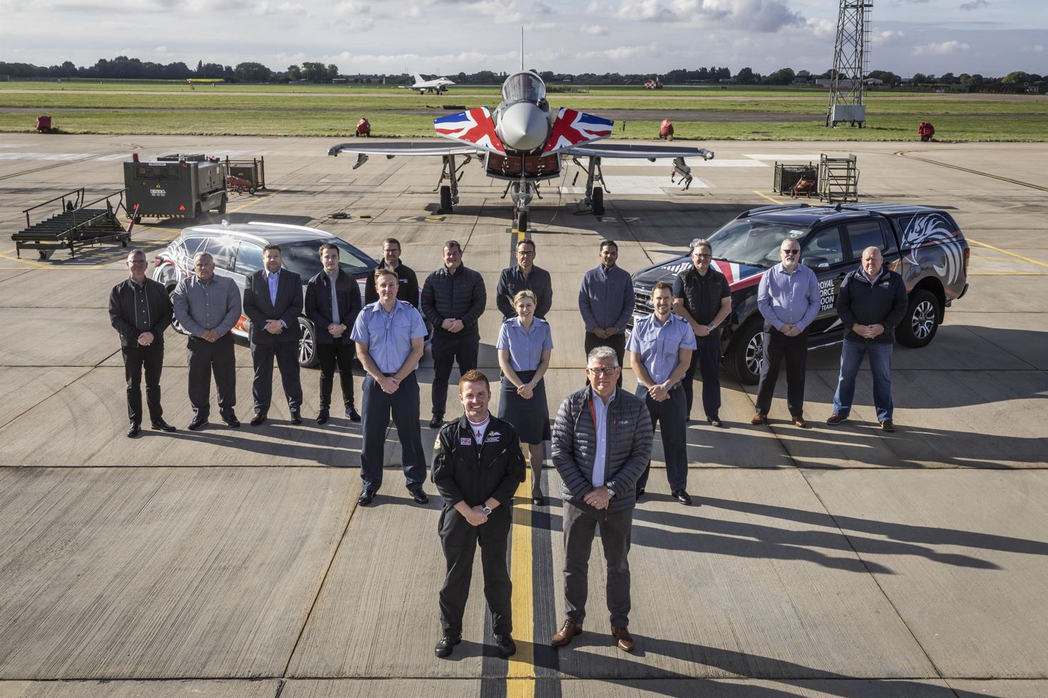 Team and clients in front of Typhoon Jet
