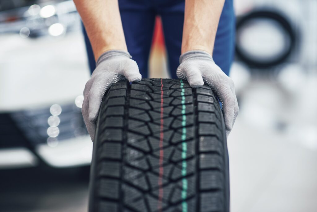 Mechanic holding Tyre