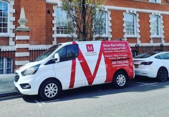 Masterfix branded van parked outside old decorative building